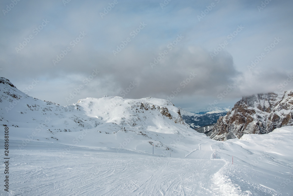 Stormy clouds in italian dolomites in a snowy winter