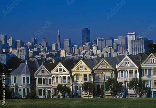 Historic houses in San Francisco and modern architecture behind. 
