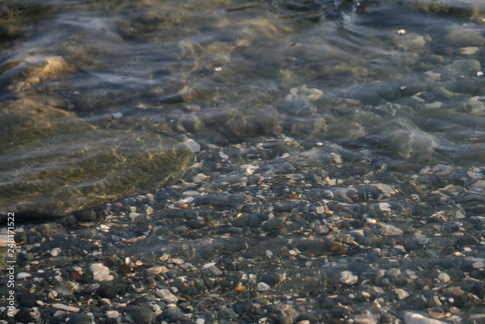 Stones and pebbles under water