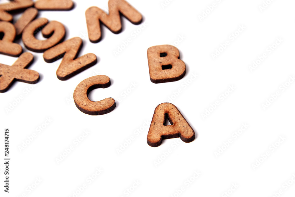 wooden cubes for the training and development of the child on a white background. child development concept. copy space for you text wooden cubes for the training and development of the child on a white background. child development concept. copy space for you text