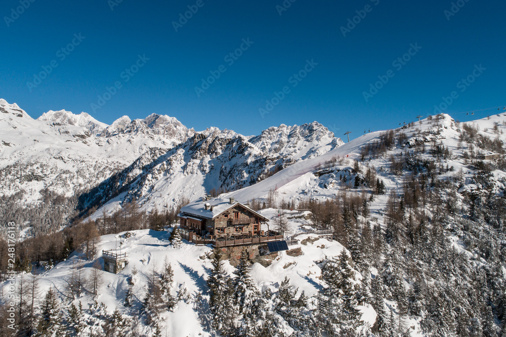 Refuge in mountain, winter landscape