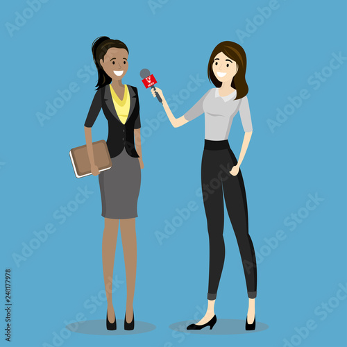 Female television reporter with microphone interviews business woman,
