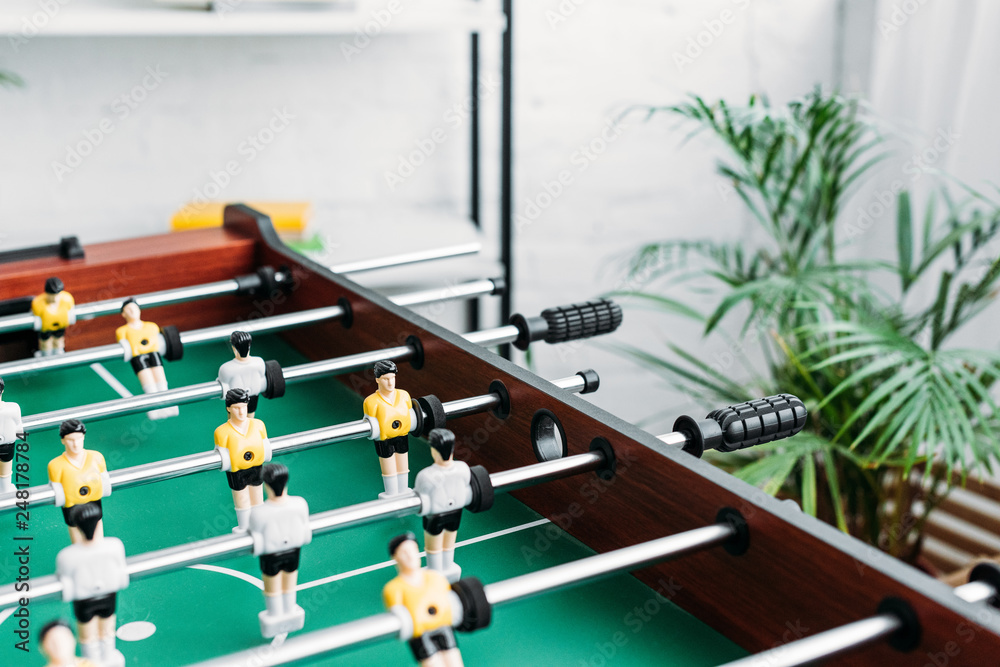 Naklejka premium selective focus of football table in living room