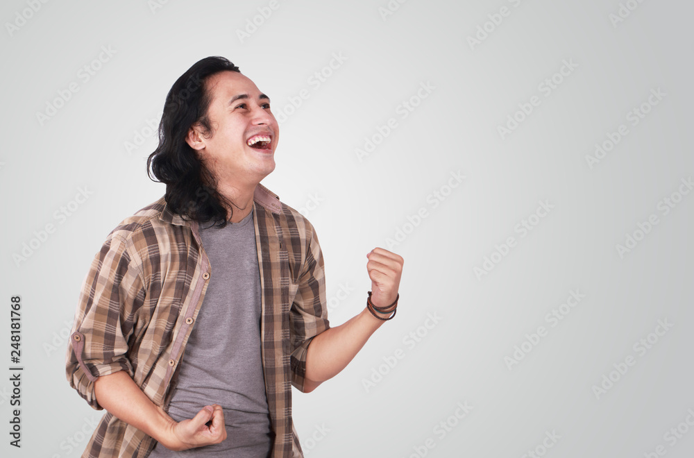 Young Man Shows Winning Gesture Young Man Shows Winning Gesture