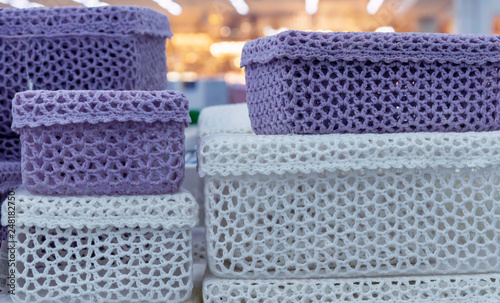 Knitted boxes for trifles in a shop window.