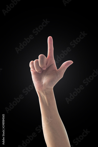 Woman's hand with index pointing finger with rim light isolated on black background (clipping path)