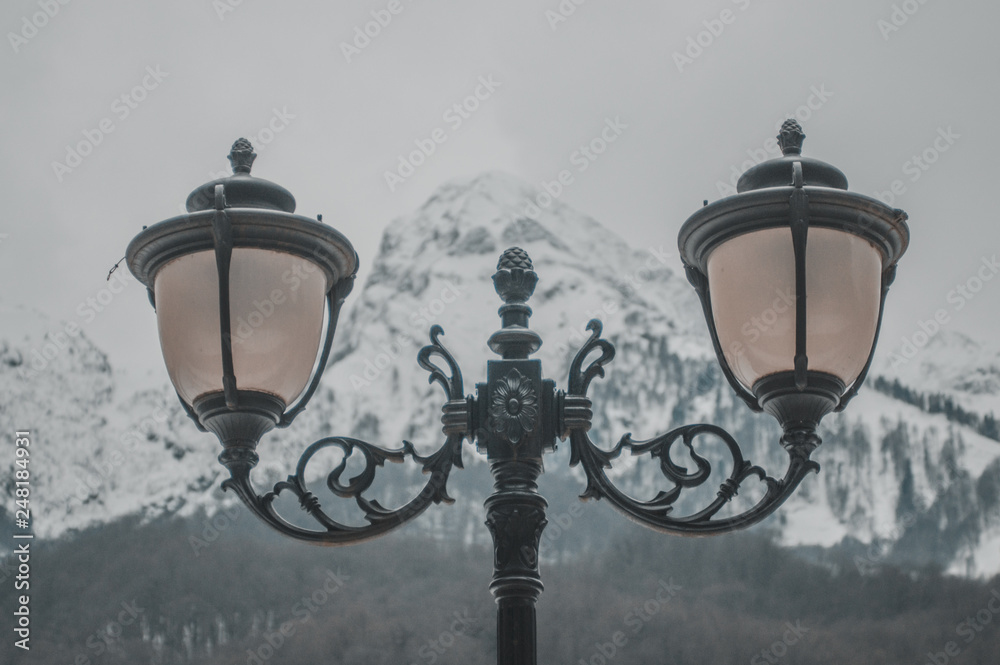 Street lamps on the background of mountains