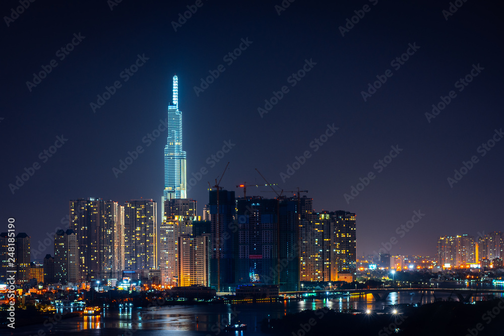 Fototapeta premium Top view of Ho Chi Minh City at night time, Vietnam.
