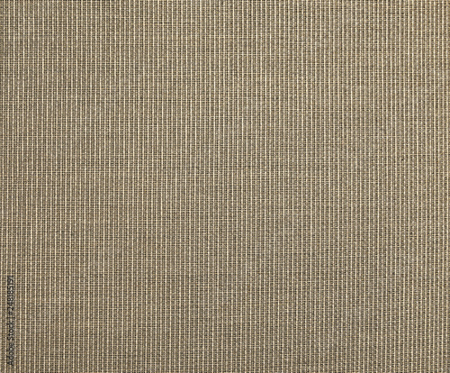 The textured beige natural fabric . 
