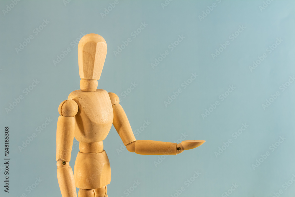 Wooden model with hands up on neutral background. Wooden model with hands up on neutral background.