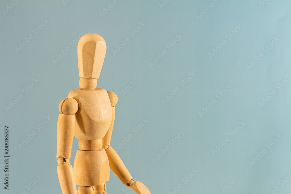 Wooden model with hands up on neutral background. Wooden model with hands up on neutral background.