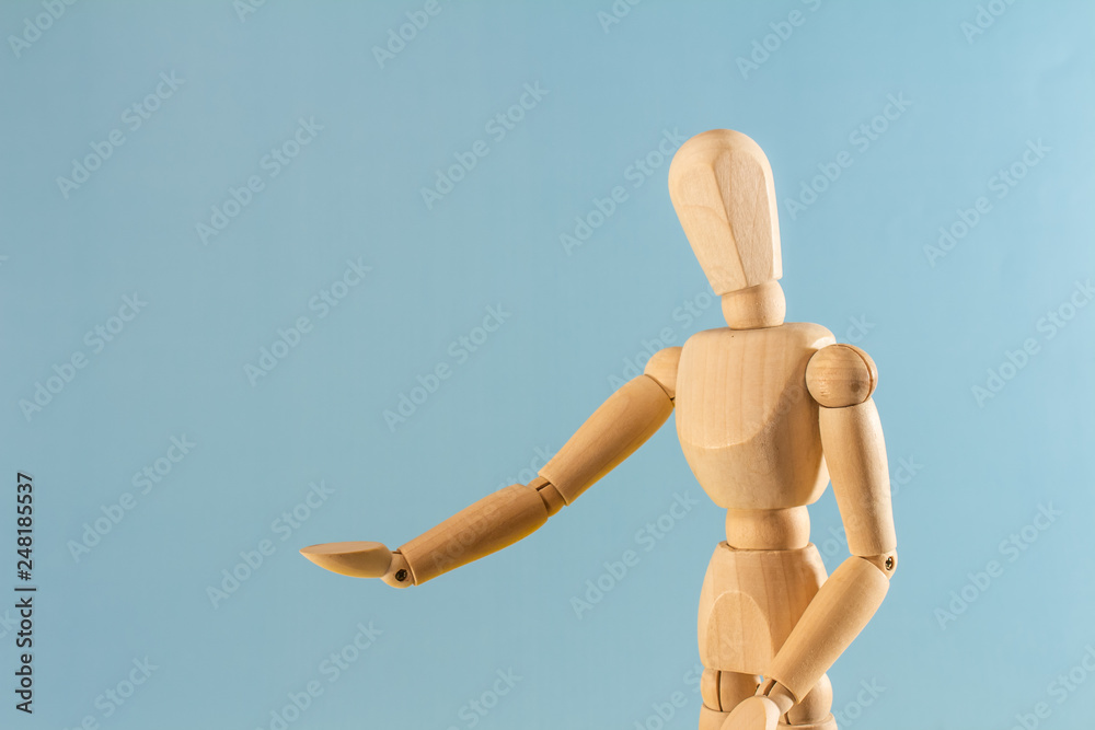 Wooden model with hands up on neutral background. Wooden model with hands up on neutral background.