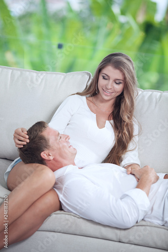 portrait of nice young couple in summer house environment