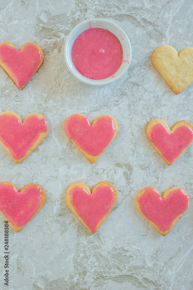 Heart shaped cookies with pink icing Heart shaped cookies with pink icing