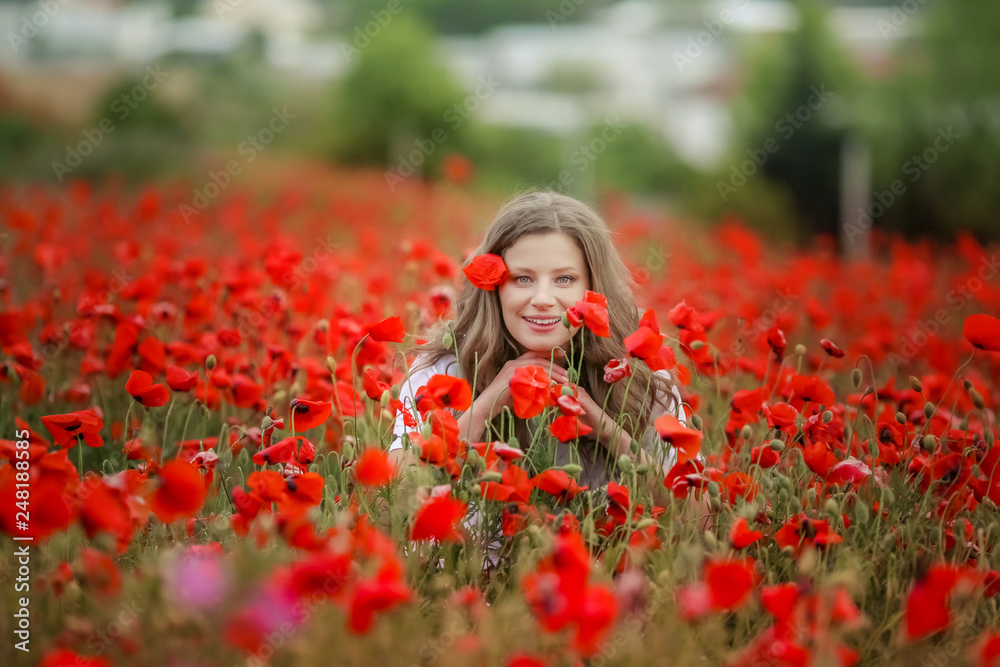 Beautiful happy smiling teen girl portrait with red flowers on head ...