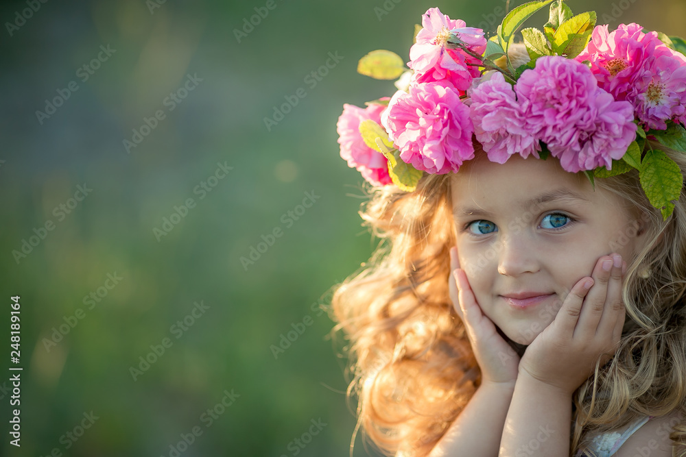 Smiling baby 3-4 year old standing with basket of flowers outdoors. Looking at camera. Summer season. Smiling baby 3-4 year old standing with basket of flowers outdoors. Looking at camera. Summer season.