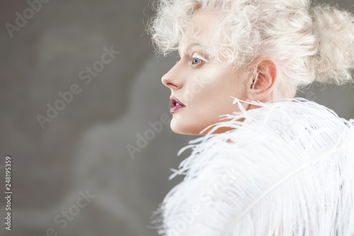 Fototapeta Naklejka Na Ścianę i Meble -  Young attractive woman with platinum blonde and purple lipstick