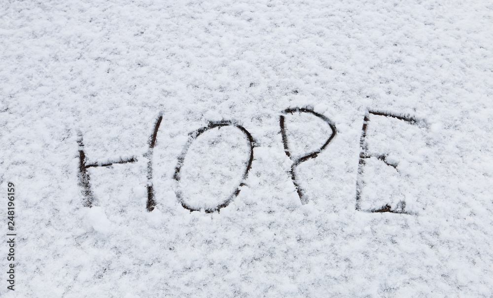 Hope handwritten on snow.