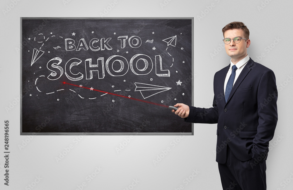 Handsome young teacher with laser pointer teaching
Handsome young teacher with laser pointer teaching