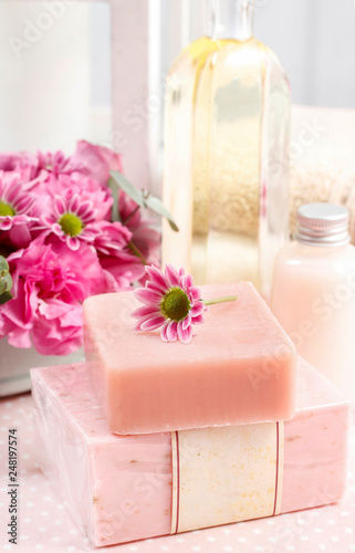 Two bars of pink soap and cute little flower.