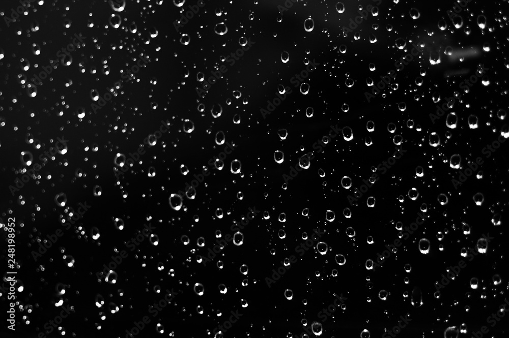 Droplets of water on black glass Droplets of water on black glass