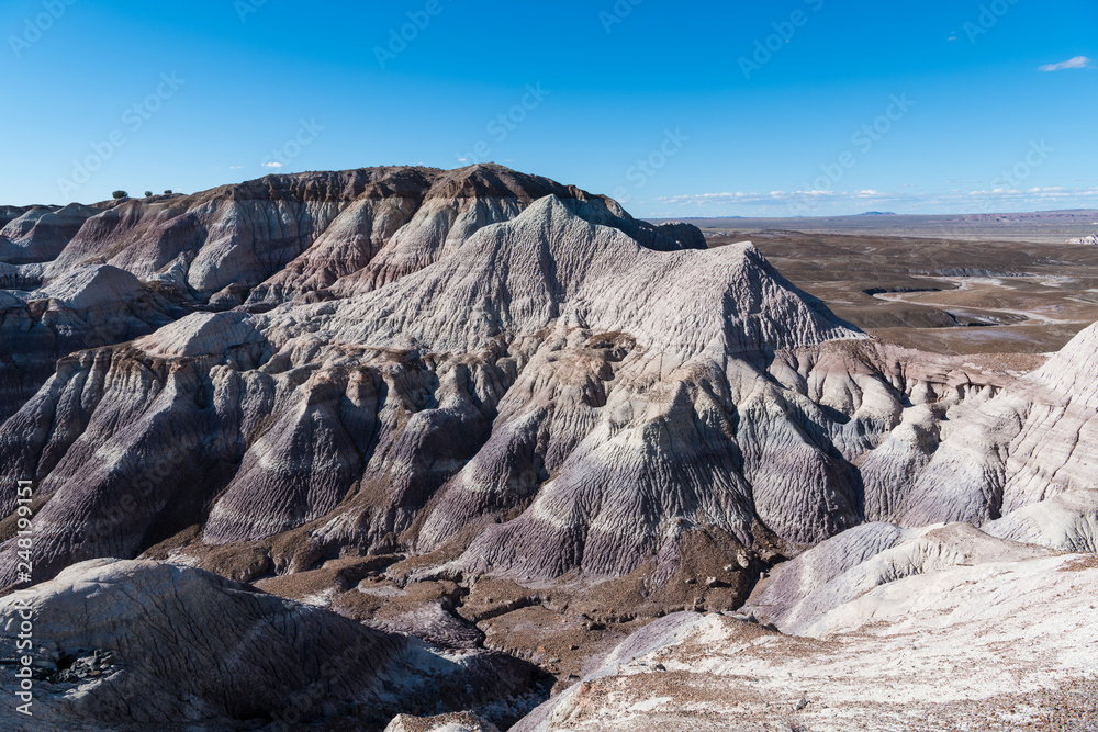 Rugged, barren, and heavily eroded desert mountain peaks in Petrified Forest National Park, Arizona