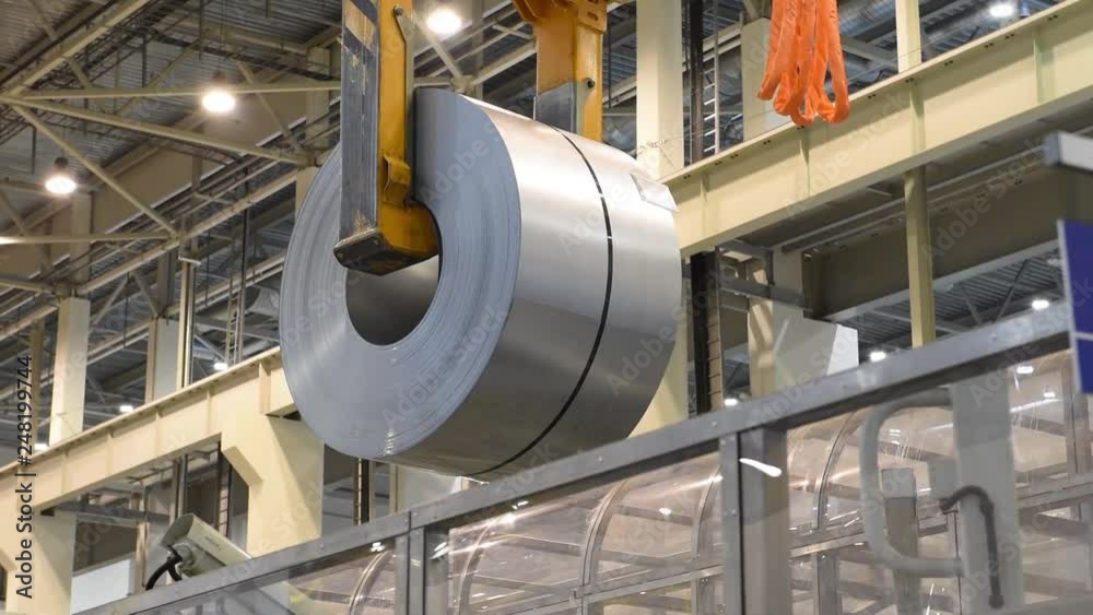 Factory Crane moves steel bobbin for passenger car production Factory Crane moves steel bobbin for passenger car production