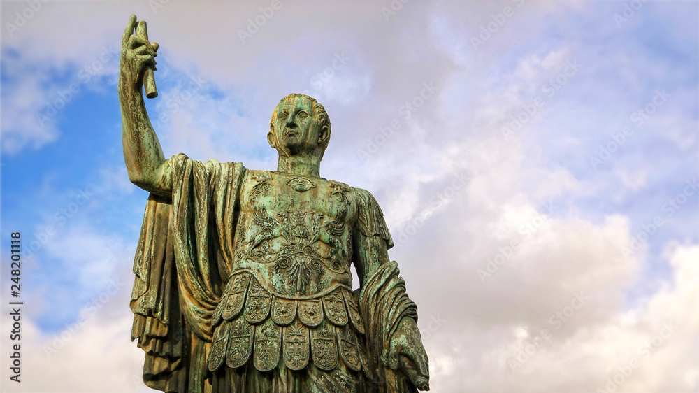 Statue of emperor Julius Caesar along Via dei Fori Imperiali at the Roman Forum in Rome, Italy Statue of emperor Julius Caesar along Via dei Fori Imperiali at the Roman Forum in Rome, Italy