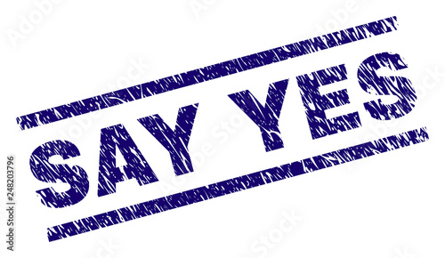 SAY YES seal print with distress style. Blue vector rubber print of SAY YES text with unclean texture. Text caption is placed between parallel lines.