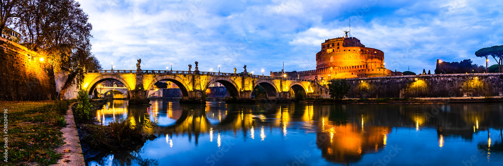 Panoramic night view of Castle Sant' Angelo in Rome, Italy