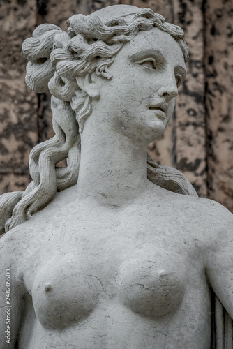 Statue of ancient sensual naked Renaissance Era woman in Potsdam, Germany, details, closeup