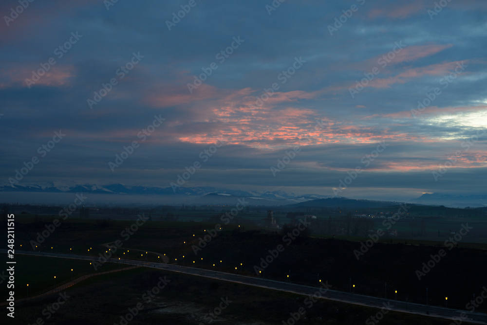 Dawn winter aurora in the snow-capped mountains surrounding the city of Vitoria-Gasteiz (Basque Country) Spain