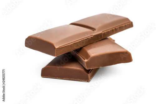 Pieces of chocolate bar on white.