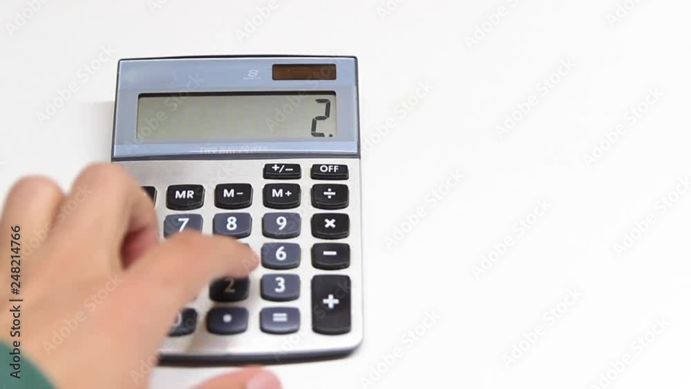 hand with calculator hand with calculator