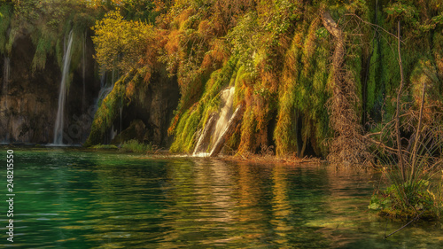 Plitvice Waterfalls in Croatia is one of the famous famous places in Europe, very beautiful. The jets of water on the background of autumn forests at sunrise are very picturesque © emotionpicture