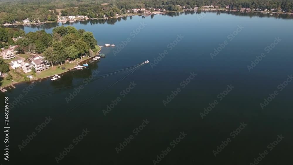 Aerial recreational boaters sailing on a fresh water sport and fishing lake