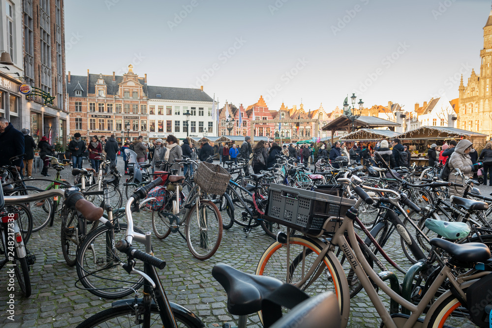 Bicycles parking at Market Square (Grote Markt) in the historic center of Bruges, winter day, Brugge, West Flanders  Belgium