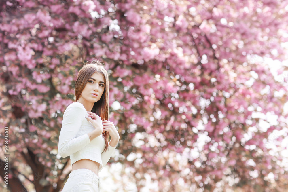 Fashion Art Beauty Portrait. Beautiful Girl in Fantasy Mystical and Magical Spring Garden. Model Fashion Art Beauty Portrait. Beautiful Girl in Fantasy Mystical and Magical Spring Garden. Model