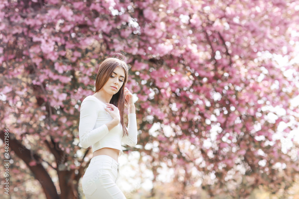 Fashion Art Beauty Portrait. Beautiful Girl in Fantasy Mystical and Magical Spring Garden. Model Fashion Art Beauty Portrait. Beautiful Girl in Fantasy Mystical and Magical Spring Garden. Model