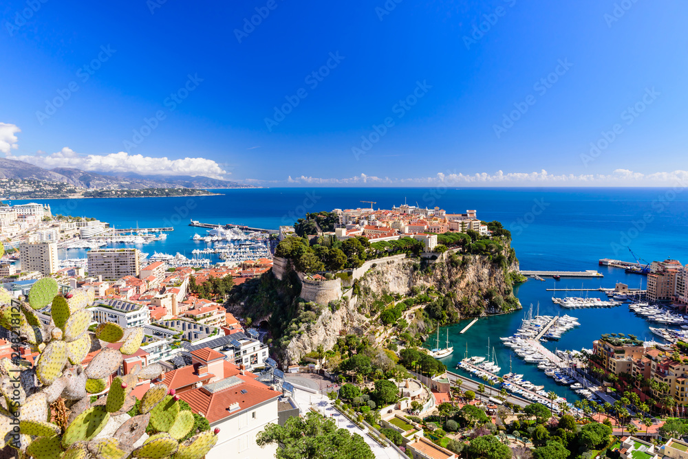 Cityscape and harbor of Monte Carlo. Aerial view of Monaco on a Sunny day, Monte Carlo, Principality of Monaco Cityscape and harbor of Monte Carlo. Aerial view of Monaco on a Sunny day, Monte Carlo, Principality of Monaco