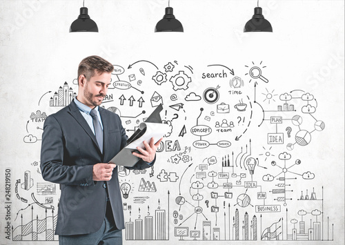 Man with clipboard, business plan photo