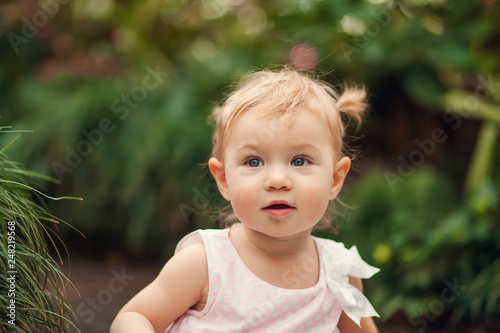 Wallpaper Mural cute little girl smiling in a park close-up Torontodigital.ca