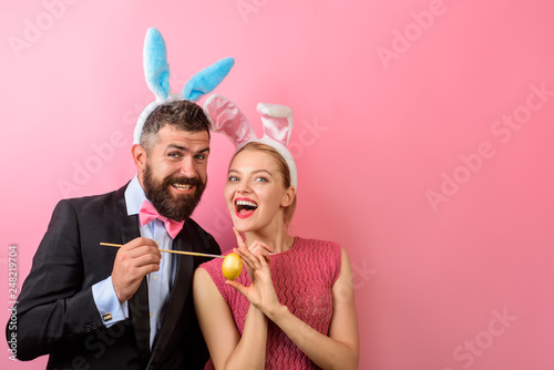 Easter Day. Family celebrate Easter. Happy couple painting eggs. Happy holidays. Couple painting eggs for Easter. Love. Decorating eggs ideas. Spring holidays. Bunny ears.