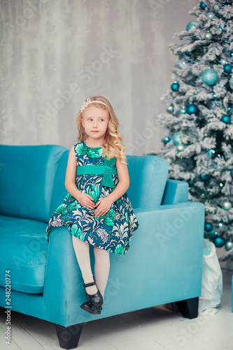 Little child girl near Christmas tree/Happy new year