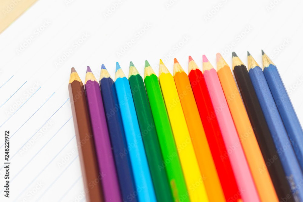 Colored pencils with light background. Back to school. School supplies. Space for text Colored pencils with light background. Back to school. School supplies. Space for text