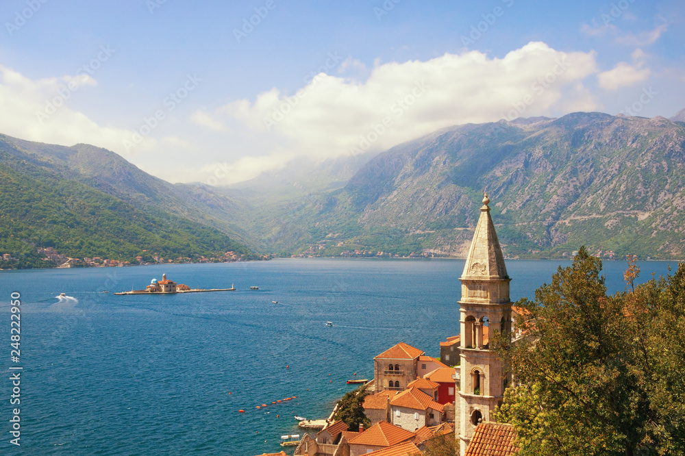 Beautiful Mediterranean landscape. Montenegro, Bay of Kotor. View of ancient town of Perast, belltower of Church of Our Lady of Rosary, Island of Our Lady of the Rocks. Travel and tourism concept