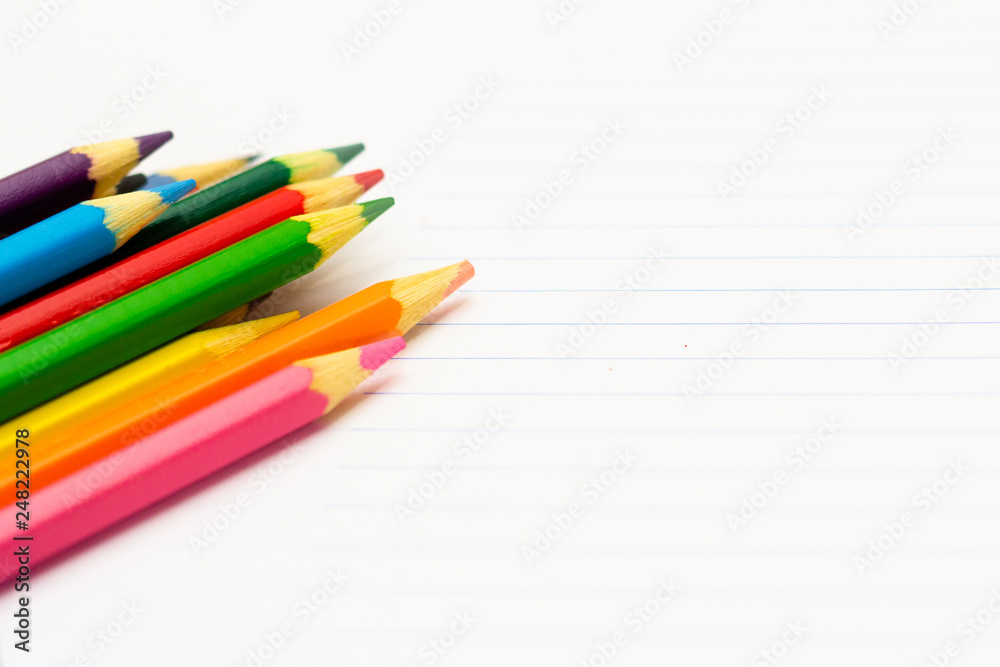 Colored pencils with light background. Back to school. School material for learning. Space for text
