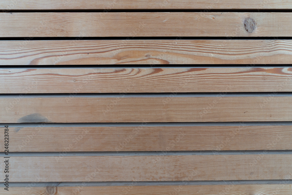 Obraz premium Surface of a transparent painted planking of a facade of horizontal wooden slats