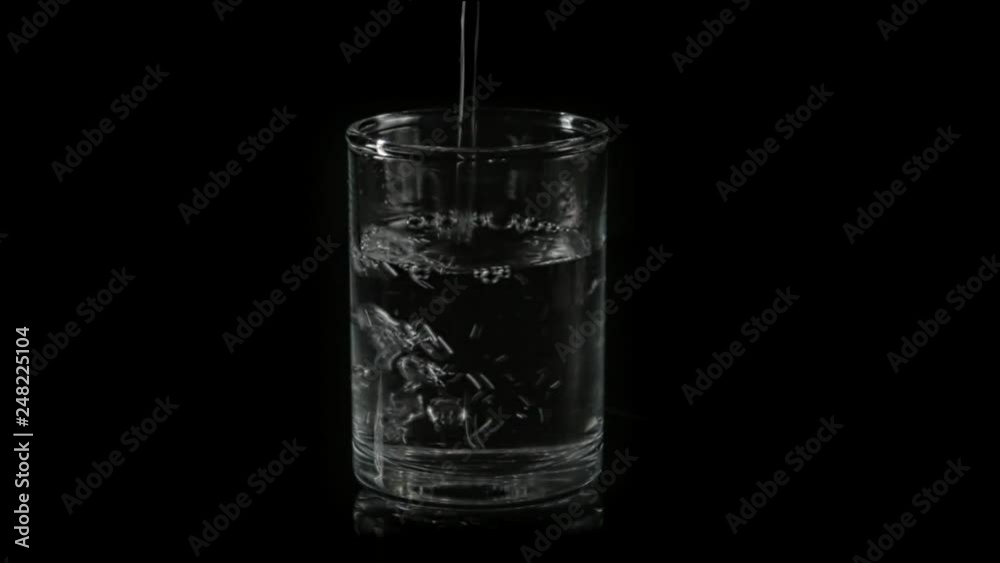 a stack of vodka on black is filled with vodka a stack of vodka on black is filled with vodka