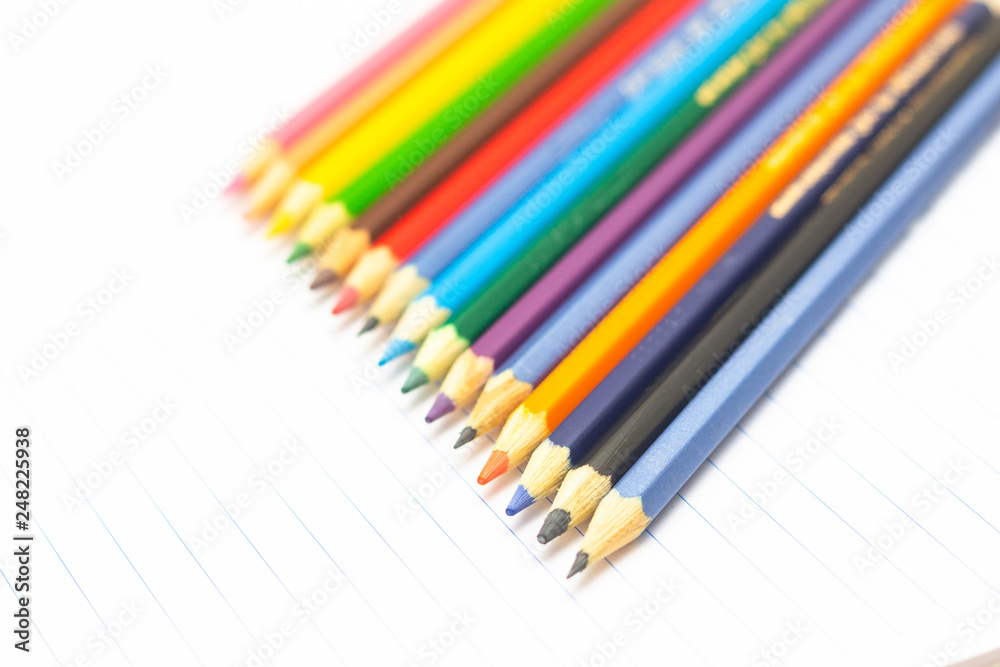 Colored pencils with light background. Back to school. School material for learning. Space for text Colored pencils with light background. Back to school. School material for learning. Space for text